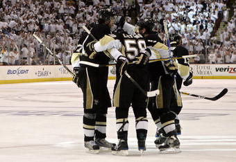 PITTSBURGH - JUNE 02:  Sergei Gonchar#55 of the Pittsburgh Penguins celebrates his third period goal with teammates Kris Letang #58, Evgeni Malkin #71 and Bill Guerin #13 during Game Three of the 2009 NHL Stanley Cup Finals on June 2, 2009 at Mellon Arena in Pittsburgh, Pennsylvania.  (Photo by Bruce Bennett/Getty Images)