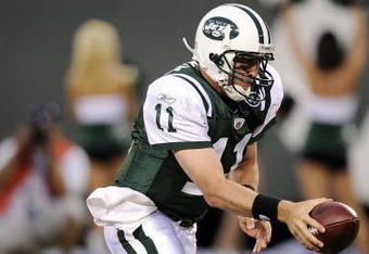 EAST RUTHERFORD, NJ - AUGUST 16:  Kellen Clemens #11 hands off in a pre-season NFL game against the Washington Redskin at Giants Stadium, August 16, 2008 in East Rutherford, New Jersey.  (Photo by Jeff Zelevansky/Getty Images)