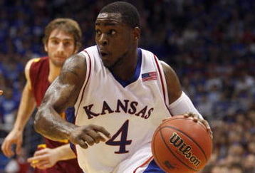 LAWRENCE, KS - FEBRUARY 18:  Sherron Collins #4 of the Kansas Jayhawks dribble drives to the basket during the game against the Iowa State Cyclones on February 18, 2009 at Phog Allen Fieldhouse in Lawrence, Kansas. Kansas defeated Iowa State 72-55. (Photo by Jamie Squire/Getty Images)
