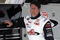 DAYTONA BEACH, FL - FEBRUARY 11:  Johnny Benson, driver of the #1 K&N Toyota, stands in garage area during practice for the NASCAR Camping World Truck Series NextEra Energy Resources 250 at Daytona International Speedway on February 11, 2009 in Daytona Beach, Florida.  (Photo by Jason Smith/Getty Images for NASCAR)