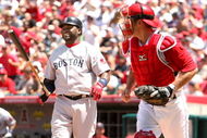 ANAHEIM, CA - MAY 14:  David Ortiz #34 of the Boston Red Sox reacts after striking out swinging with the bases loaded to end the fourth inning as catcher Jeff Mathis #5 of the Los Angeles Angels of Anaheim returns to the dugout on May 14, 2009 at Angel Stadium in Anaheim, California.  The Angels won 5-4 in 12 innings.  (Photo by Stephen Dunn/Getty Images)