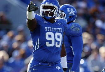 LEXINGTON, KY - NOVEMBER 8:  Jeremy Jarmon #99 of the Kentucky Wildcats points during the game against the Georgia Bulldogs at Commonwealth Stadium on November 8, 2008 in Lexington, Kentucky. (Photo by Andy Lyons/Getty Images)