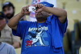 LOS ANGELES - MAY 7:  A fan wearing a Manny Ramirez tee shirt for takes a picture during pregame before the game between the Los Angeles Dodgers and the Washington Nationals on May 7, 2009 at Dodger Stadiium in Los Angeles, California.    (Photo by Stephen Dunn/Getty Images)