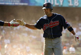 LOS ANGELES - JUNE 21:  Jamey Carroll #7 of the Cleveland Indians celebrates after sliding across the plate with the go ahead run in the 11th inning against the Los Angeles Dodgers at Dodger Stadium June 21, 2008 in Los Angeles, California. The Indians won 7-2 in 11 innings.  (Photo by Stephen Dunn/Getty Images)