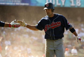 LOS ANGELES - JUNE 21:  Jamey Carroll #7 of the Cleveland Indians celebrates after sliding across the plate with the go ahead run in the 11th inning against the Los Angeles Dodgers at Dodger Stadium June 21, 2008 in Los Angeles, California. The Indians won 7-2 in 11 innings.  (Photo by Stephen Dunn/Getty Images)
