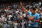 PARIS - JUNE 07:   Roger Federer of Switzerland salutes the fans as he holds the trophy following victory during the Men's Singles Final match against Robin Soderling of Sweden on day fifteen of the French Open at Roland Garros on June 7, 2009 in Paris, France.  (Photo by Ryan Pierse/Getty Images)