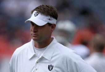 DENVER - SEPTEMBER 16:  Head coach Lane Kiffin watch his team during warm up as the Denver Broncos defeated the Oakland Raiders 23-20 in overtime during week two NFL action at Invesco Field at Mile High on September 16, 2007 in Denver, Colorado.  (Photo by Doug Pensinger/Getty Images)