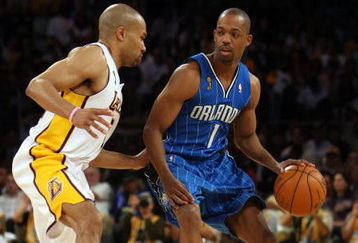 LOS ANGELES, CA - JUNE 07:  Rafer Alston #1 of the Orlando Magic drives on Derek Fisher #2 of the Los Angeles Lakers in Game Two of the 2009 NBA Finals at Staples Center on June 7, 2009 in Los Angeles, California. NOTE TO USER: User expressly acknowledges and agrees that, by downloading and or using this photograph, User is consenting to the terms and conditions of the Getty Images License Agreement.  (Photo by Stephen Dunn/Getty Images)