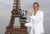 PARIS - JUNE 06:  New ladies French Open champion Svetlana Kuznetsova of Russia poses with the trophy in front of the Eiffel Tower on day fourteen of the French Open on June 6, 2009 in Paris, France.  (Photo by Ryan Pierse/Getty Images)