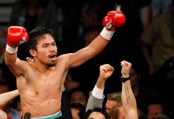 LAS VEGAS - MAY 02:  Manny Pacquiao of the Philippines celebrates after knocking out Ricky Hatton of England in the second round of their junior welterweight title fight at the MGM Grand Garden Arena May 2, 2009 in Las Vegas, Nevada.  (Photo by Ethan Miller/Getty Images)