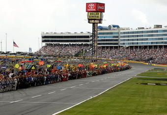 CONCORD, NC - MAY 25:  Crew members stand on pit road during a red flag for the national moment of remembrance  during the NASCAR Sprint Cup Series Coca-Cola 600 on May 25, 2009 at Lowe's Motor Speedway in Concord, North Carolina.  (Photo by Streeter Lecka/Getty Images)