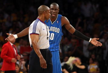 LOS ANGELES, CA - JUNE 07:  Mickael Pietrus #20 of the Orlando Magic argues a call with referee Tom Washington #49 in the first quarter of Game Two of the 2009 NBA Finals against the Los Angeles Lakers at Staples Center on June 7, 2009 in Los Angeles, California. NOTE TO USER: User expressly acknowledges and agrees that, by downloading and or using this photograph, User is consenting to the terms and conditions of the Getty Images License Agreement.  (Photo by Jed Jacobsohn/Getty Images)
