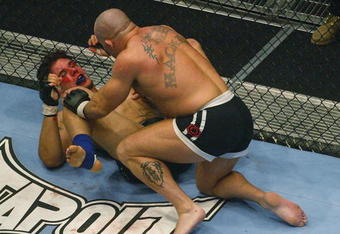 LONDON - JULY 13:  Ian Freeman of Great Britain fights with Frank Mir of the USA during the Ultimate Fighting Championship, 'Brawl in the Royal Albert Hall', in the Royal Albert Hall London, England on July 13, 2002. (Photo by Mike Hewitt/Getty Images)