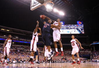 INDIANAPOLIS - MARCH 27:  Jordan Hill #43 of the Arizona Wildcats fights for a rebound against Earl Clark #5 of the Louisville Cardinals  during the third round of the NCAA Division I Men's Basketball Tournament at the Lucas Oil Stadium on March 27, 2009 in Indianapolis, Indiana.  (Photo by Andy Lyons/Getty Images)