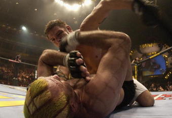 LONDON - JULY 13:  Renato 'Babalu' Sobral of Brazil throws a punch at Elvis Sinosic of Australia during the Ultimate Fighting Championship, 'Brawl in the Royal Albert Hall', in the Royal Albert Hall London, England on July 13, 2002. (Photo by John Gichigi / Getty Images)