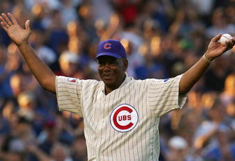 CHICAGO - OCTOBER 06:  Baseball Hall of Famer and former Chicago Cub Ernie Banks acknowledges the fans prior to throwing out the ceremonial first pitch prior to Game Three of the National League Divisional Series between the Chicago Cubs and the Arizona Diamondbacks at Wrigley Field on October 6, 2007 in Chicago, Illinois.  (Photo by Chris McGrath/Getty Images)