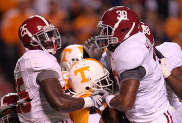 KNOXVILLE, TN - OCTOBER 25: Arian Foster #27 of the Tennessee Volunteers is tackled by Rolando McClain #25 and Dont'a Hightower #30 of the Alabama Crimson Tide during the game at Neyland Stadium on October 25, 2008 in Knoxville, Tennessee.  (Photo by Andy Lyons/Getty Images)