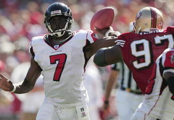 SAN FRANCISCO - SEPTEMBER 12:  Quarterback Michael Vick #7 of the Atlanta Falcons passes the ball during the game against the San Francisco 49ers at 3Com Park on September 12, 2004 in San Francisco, California. The Falcons won 21-19.  (Photo by Jed Jacobsohn/Getty Images)