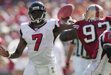 SAN FRANCISCO - SEPTEMBER 12:  Quarterback Michael Vick #7 of the Atlanta Falcons passes the ball during the game against the San Francisco 49ers at 3Com Park on September 12, 2004 in San Francisco, California. The Falcons won 21-19.  (Photo by Jed Jacobsohn/Getty Images)