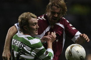 GLASGOW, UNITED KINGDOM - NOVEMBER 04: Aiden McGeady of Celtic tackles Robbie Neilson of Hearts during the Scottish Premier League match between Celtic and Hearts at Celtic Park November 4, 2006 in Glasgow, Scotland  (Photo by Jeff J Mitchell/Getty Images)
