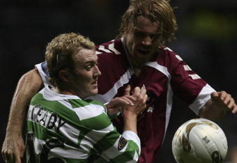 GLASGOW, UNITED KINGDOM - NOVEMBER 04: Aiden McGeady of Celtic tackles Robbie Neilson of Hearts during the Scottish Premier League match between Celtic and Hearts at Celtic Park November 4, 2006 in Glasgow, Scotland  (Photo by Jeff J Mitchell/Getty Images)