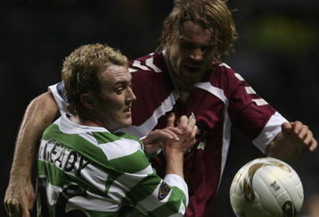 GLASGOW, UNITED KINGDOM - NOVEMBER 04: Aiden McGeady of Celtic tackles Robbie Neilson of Hearts during the Scottish Premier League match between Celtic and Hearts at Celtic Park November 4, 2006 in Glasgow, Scotland  (Photo by Jeff J Mitchell/Getty Images)