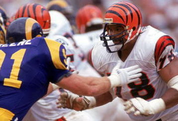 ANAHEIM, CA - OCTOBER 7:  Tackle Anthony Munoz #78 of the Cincinnati Bengals matches up against linebacker Kevin Greene #91 of the Los Angeles Rams during a game at the Anaheim Stadium on October 7, 1990 in Anaheim, California.  Munoz is in his 10th year out from USC.   The Bengals won 34-31.  (Photo by George Rose/Getty Images)