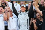 ISTANBUL, TURKEY - JUNE 07:  Jenson Button of Great Britain and Brawn GP celebrates with team mates in the paddock after winning the Turkish Formula One Grand Prix at Istanbul Park on June 7, 2009, in Istanbul, Turkey.  (Photo by Mark Thompson/Getty Images)