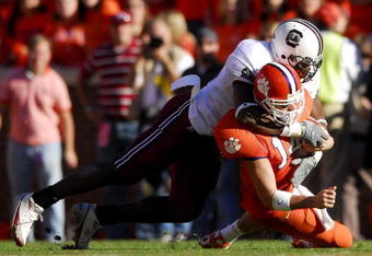 CLEMSON, SC - NOVEMBER 25:  Jasper Brinkley #52 of the South Carolina Gamecocks sacks quarterback Will Proctor #14 of the Clemson Tigers during an NCAA football game at Memorial Stadium November 25, 2006 in Clemson, South Carolina. South Carolina won 31-28.  (Photo by Grant Halverson/Getty Images)