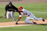 JUPITER, FL - FEBRUARY 25:  Third baseman Tyler Greene #67 of the St. Louis Cardinals tags out Robert Andino #11 of the Florida Marlins after being caught in a rundown in the ninth inning during a spring training game at Roger Dean Stadium on February 25, 2009 in Jupiter, Florida.  (Photo by Doug Benc/Getty Images)
