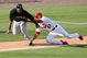 JUPITER, FL - FEBRUARY 25: Third baseman Tyler Greene #67 of the St. Louis Cardinals tags out Robert Andino #11 of the Florida Marlins after being caught in a rundown in the ninth inning during a spring training game at Roger Dean Stadium on February 25, 2009 in Jupiter, Florida. (Photo by Doug Benc/Getty Images)