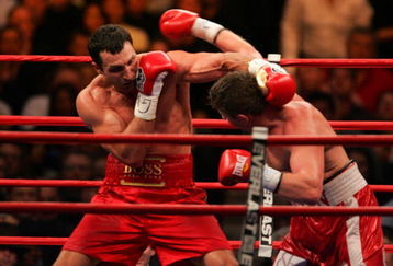 NEW YORK - FEBRUARY 23:  Wladimir Klitschko (L) of Ukraine trades punches with Sultan Ibragimov (R) of Russia during their WBO and IBF/IBO Unification Heavyweight World Championship bout on February 23, 2008 at Madison Square Garden in New York City.  (Photo by Chris Trotman/Getty Images)