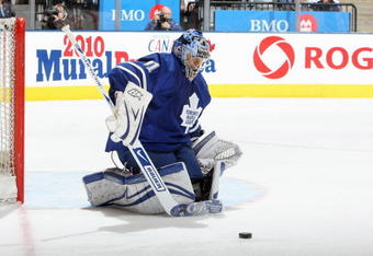TORONTO - APRIL 8: Goalie Curtis Joseph #31 of the Toronto Maple Leafs stops the puck against the Buffalo Sabres during their NHL game at the Air Canada Centre on April 8, 2009 in Toronto, Ontario. (Photo by: Dave Sandford/Getty Images)