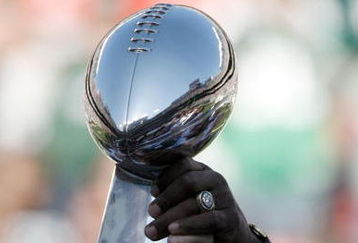 EAST RUTHERFORD, NJ - OCTOBER 26:  Members of the 1968 Jets touch the Lombardi Trophy during halftime festivities celebrating the 40th anniversary of the team's win over the Colts in Super Bowl III during the game between the Kansas City Chiefs and the New York Jets on October 26, 2008 at Giants Stadium in East Rutherford, New Jersey.  (Photo by Jarrett Baker/Getty Images)