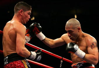 NEW YORK - FEBRUARY 21:  Michael Jennings (L) and Miguel Cotto exchange punches during their WBO World Welterweight title bout at Madison Square Garden on February 21, 2009 in New York City.  (Photo by Chris Trotman/Getty Images)