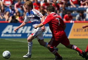 BRIDGEVIEW, IL - MAY 31: Dax McCarty #13 of FC Dallas pushes the ball away from Logan Pause #7 of the Chicago Fire on May 31, 2009 at Toyota Park in Bridgeview, Illinois. FC Dallas defeated the Fire 3-0. (Photo by Jonathan Daniel/Getty Images)