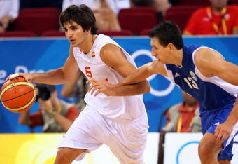 BEIJING - AUGUST 10:  Ricky Rubio #6 of Spain drives on Dimitrios Diamantidis #13 of Greece during the day 2 preliminary game at the Beijing 2008 Olympic Games in the Beijing Olympic Basketball Gymnasium on August 10, 2008 in Beijing, China.  (Photo by Phil Walter/Getty Images)