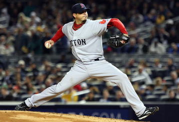 NEW YORK - MAY 05:  Josh Beckett #19 of the Boston Red Sox delivers a pitch against the New York Yankees on May 5, 2009 at Yankee Stadium in the Bronx borough of New York City. The Red Sox defeated the Yankees 7-3.  (Photo by Jim McIsaac/Getty Images)
