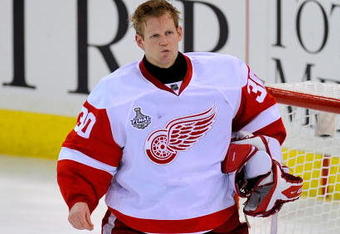 PITTSBURGH - JUNE 09:  Goaltender Chris Osgood #30 of the Detroit Red Wings reacts after being scored on in the second period by Jordan Staal #11 (not pictured) of the Pittsburgh Penguins during Game Six of the NHL Stanley Cup Finals at the Mellon Arena on June 9, 2009 in Pittsburgh, Pennsylvania.  (Photo by Jamie Sabau/Getty Images)