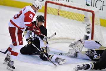 PITTSBURGH - JUNE 09:  Rob Scuderi #4 and goaltender Marc-Andre Fleury #29 of the Pittsburgh Penguins defends the net against Johan Franzen #93 of the Detroit Red Wings during Game Six of the NHL Stanley Cup Finals at the Mellon Arena on June 9, 2009 in Pittsburgh, Pennsylvania.  (Photo by Jamie Sabau/Getty Images)