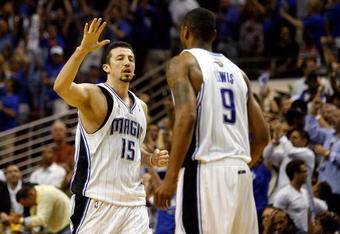 ORLANDO, FL - JUNE 09:  Hedo Turkoglu #15 of the Orlando Magic gives teammate Rashard Lewis #9 a high five in the fourth quarter of Game Three of the 2009 NBA Finals against the Los Angeles Lakers on June 9, 2009 at Amway Arena in Orlando, Florida.  NOTE TO USER:  User expressly acknowledges and agrees that, by downloading and or using this photograph, User is consenting to the terms and conditions of the Getty Images License Agreement.  (Photo by Chris Graythen/Getty Images)