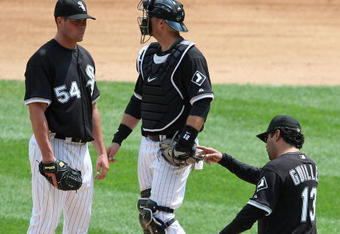 CHICAGO - JUNE 08: Manager Ozzie Guillen #13 of the Chicago White Sox calls for a relief pitcher as he removes starting pitcher Clayton Richard #54 from a game against the Detroit Tigers as A.J. Pierzynski #12 looks to the bullpen on June 8, 2009 at U.S. Cellular Field in Chicago, Illinois. The Tigers defeated the White Sox 5-4. (Photo by Jonathan Daniel/Getty Images)