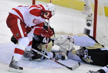PITTSBURGH - JUNE 09:  Rob Scuderi #4 and goaltender Marc-Andre Fleury #29 of the Pittsburgh Penguins defends the net against Johan Franzen #93 of the Detroit Red Wings during Game Six of the NHL Stanley Cup Finals at the Mellon Arena on June 9, 2009 in Pittsburgh, Pennsylvania.  (Photo by Jamie Sabau/Getty Images)