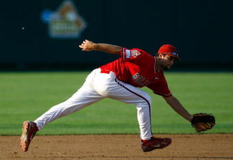 OMAHA, NE - JUNE 25:  Tommy Mendonca #32 of the Fresno State Bulldogs reaches for a ground ball against the Georgia Bulldogs during Game 3 of the 2008 Men's College World Series Championship June 25, 2008 at Rosenblatt Stadium in Omaha, Nebraska.   Fresno State defeated Georgia 6-1.  (Photo by Kevin C. Cox/Getty Images)