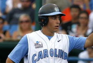 OMAHA, NE - JUNE 21:  First baseman Dustin Ackley #13 of the North Carolina Tar Heels celebrates with teammates after hitting a solo homer in the second inning to the give the Tar Heels a 1-0 lead over the Rice Owls in Game 13 of the NCAA College World Series at Rosenblatt Stadium on June 21, 2007 in Omaha, Nebraska. (Photo by Kevin C. Cox/Getty Images) 