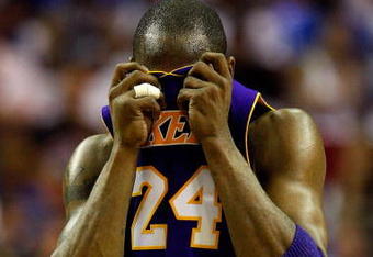 ORLANDO, FL - JUNE 09:  Kobe Bryant #24 of the Los Angeles Lakers wipes his face during the game against the Orlando Magic in Game Three of the 2009 NBA Finals on June 9, 2009 at Amway Arena in Orlando, Florida.  NOTE TO USER:  User expressly acknowledges and agrees that, by downloading and or using this photograph, User is consenting to the terms and conditions of the Getty Images License Agreement.  (Photo by Ronald Martinez/Getty Images)