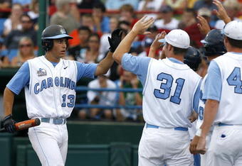 OMAHA, NE - JUNE 21:  First baseman Dustin Ackley #13 of the North Carolina Tar Heels celebrates with teammates after hitting a solo homer in the second inning to the give the Tar Heels a 1-0 lead over the Rice Owls in Game 13 of the NCAA College World Series at Rosenblatt Stadium on June 21, 2007 in Omaha, Nebraska. (Photo by Kevin C. Cox/Getty Images) 