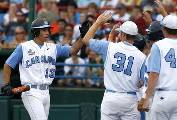 OMAHA, NE - JUNE 21:  First baseman Dustin Ackley #13 of the North Carolina Tar Heels celebrates with teammates after hitting a solo homer in the second inning to the give the Tar Heels a 1-0 lead over the Rice Owls in Game 13 of the NCAA College World Series at Rosenblatt Stadium on June 21, 2007 in Omaha, Nebraska. (Photo by Kevin C. Cox/Getty Images) 