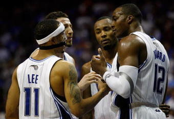 ORLANDO, FL - JUNE 09:  (R-L) Dwight Howard #12, Rashard Lewis #9, Hedo Turkoglu #15 and Courtney Lee #11 of the Orlando Magic talk in the second quarter against the Los Angeles Lakers in Game Three of the 2009 NBA Finals on June 9, 2009 at Amway Arena in Orlando, Florida.  NOTE TO USER:  User expressly acknowledges and agrees that, by downloading and or using this photograph, User is consenting to the terms and conditions of the Getty Images License Agreement.  (Photo by Chris Graythen/Getty Images)