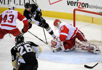 PITTSBURGH - JUNE 09:  Tyler Kennedy #48 of the Pittsburgh Penguins shoots a goal past goaltender Chris Osgood #30 of the Detroit Red Wings during Game Six of the NHL Stanley Cup Finals at the Mellon Arena on June 9, 2009 in Pittsburgh, Pennsylvania.  (Photo by Harry How/Getty Images)